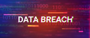 An abstract concept shot with the words “data breach” transposed over binary coding.